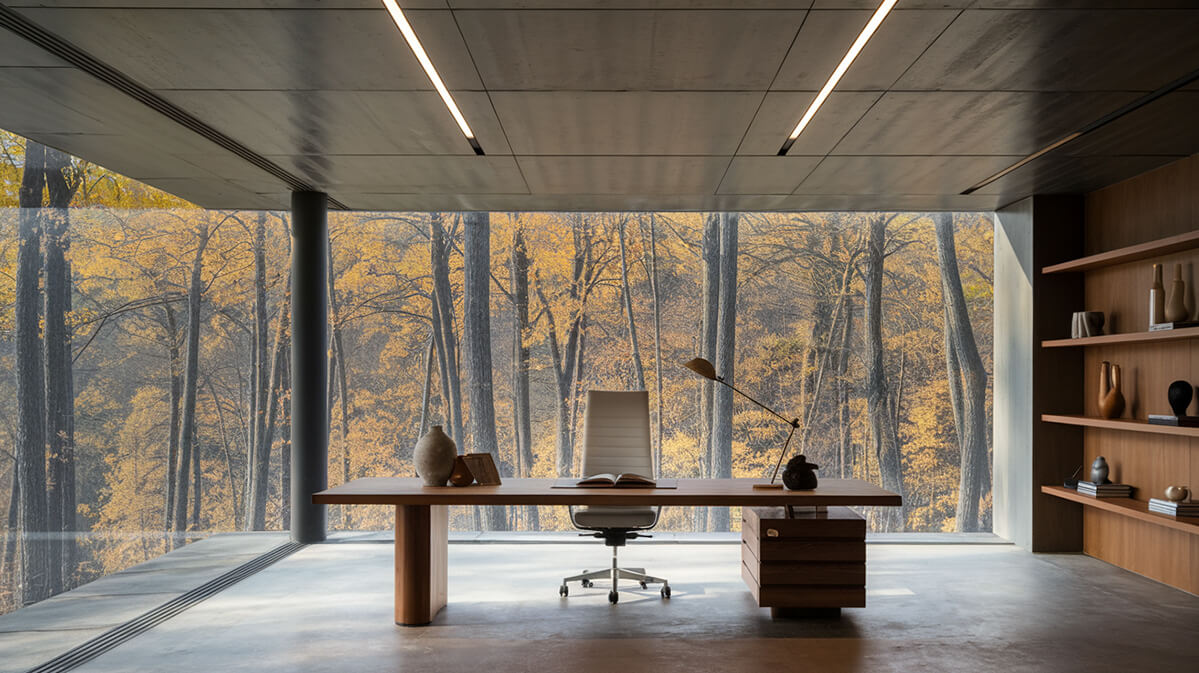 Spațiu de birou modern cu design minimalist și priveliște naturală Birou modern și minimalist, cu vedere panoramică către o pădure de toamnă.