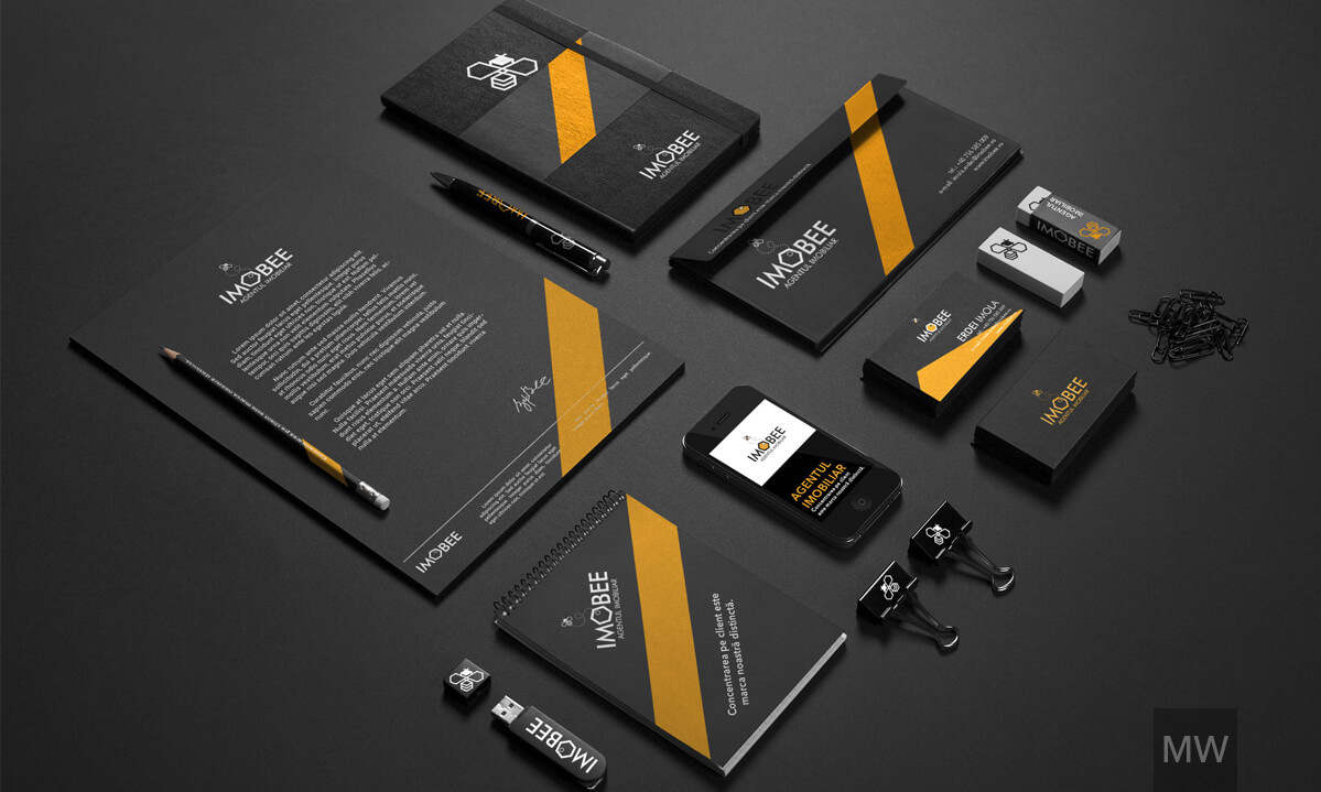 Comprehensive Branding and Stationery A comprehensive branding and stationery set for 'IMOBEE,' featuring a letterhead, notepad, business cards, and a mobile phone with an app, all arranged on a dark background.