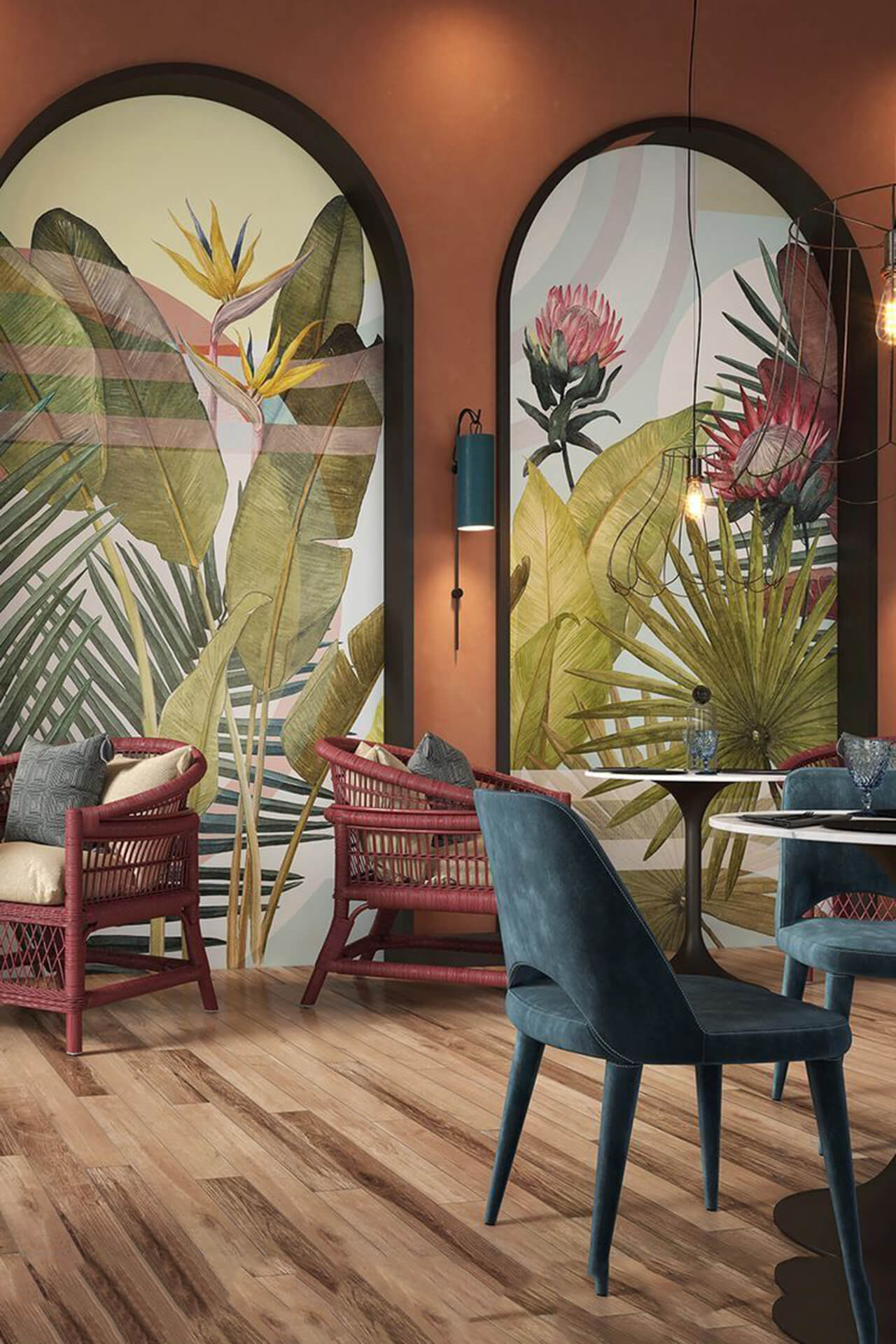 Tropical-inspired room with arch murals and modern-rustic decor Vibrant room with arch-shaped tropical murals, wicker chairs, wooden floor, and contemporary table settings.