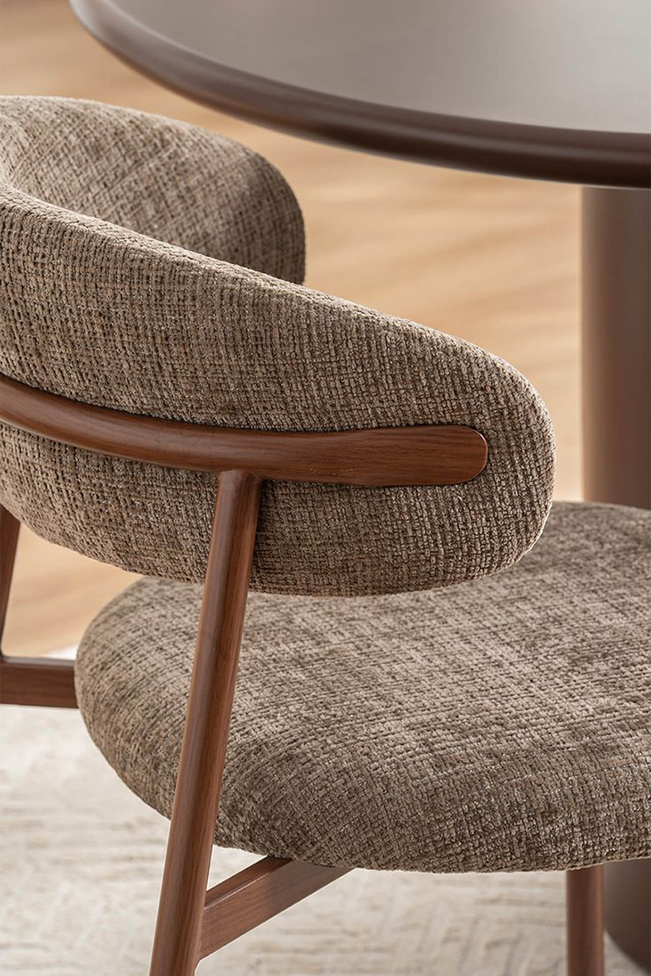 Elegant Mid-Century Modern Armchair Mid-century modern armchair with textured fabric and wooden armrests